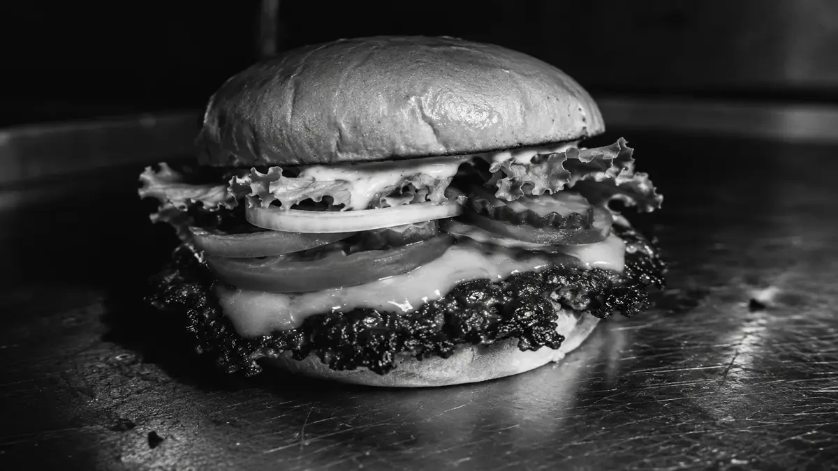 La Clásica — single smash patty, American cheese, escarola
